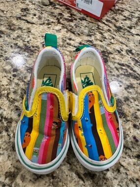 Vans Kids Slip-On Sneakers in Yellow, Blue, Green, Pink and Orange Stripe